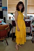 This dress looks exactly as pictured. It's a beautiful color and feel. The sheer portions are extremely tasteful in coverage. This is perfect for the May wedding I plan to wear it to. - Melanie C.