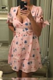 Super cute and definitely long enough for me. A little low cut but I may have it altered to fix that and remove the bows. They are kinda distracting. Side zipper gets stuck a bit but will rub soap to see if that helps. - Shelly K.