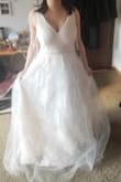 Would recommend it to any bride who wants a simple yet elegant dress. Color is ivory instead of white. Looks good in pictures! - Yu W.