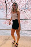 It's very comfy and is the perfect length to not be too long or short. The material is soft and the color is a deep blue as pictured. It has some stretch and is overall very flexible. This is by far my favorite skirt. - Alyssa S.