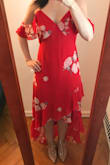 Such a fun dress! I'm usually between a 4/6 or S/M in dresses, I sized up for this dress based on other reviews regarding the waist and, although the fit was a little loose, I don't think another size would have fit as well. I do plan on wearing Spanx with it because the material clung to my belly more than I would like. Love the red color, the sheer off-the-shoulder sleeves, and the unique bottom cut! - Sarah Q.