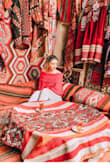It's a very comfortable sweater. The fabric is soft, it's a very gorgous red. I love it - Anita S.