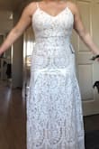 So pretty. Didn't realize the slip underneath was darker than ivory, but I still love it. Stretchy, and fits well! Perfect length. 
Lace is delicate and train is elegant. - Jennifer G.