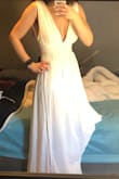 Absolutely in love with this dress! I have it in 2 colors, :D it is stunning. I have a xsmall in blue that is too tight around bust area but otherwise fits perfect. I got a small in white and it fits just too much room in the straps have to get them altered and of course the dress hemmed. Would recommend this dress! Not too busty, just enough to look sexy and classy. - Rochelle M.
