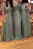 I wore this as a bridesmaid to a friends wedding and I feel like it looked really pretty in pictures. It fits very true to size and is flattering on many different body types. For people under 5'5" it will probably need to be hemmed because it is a bit long. - Caitlin H.