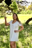 I wore this dress for my graduation photos and will be wearing for graduation! I love the style, but it is very wide and doesn't have a whole lot of shape. Still very cute though. - Jamie M.