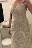 This is the dress I'm going to wear for my wedding. It has a lovely delicate lace and the train is gorgeous. My only issue is that (unlike in the model pictures) the scallops from the bottom of the dress are added to the hip area and the the pleats were pulling on that lace in an unflattering way. I am returning this dress but reordering the next size up. - Morgan S.