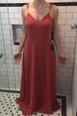 This is a delicate, flowy dress that is really feminine.

Pros: straps are adjustable, buttons on the back are real and are sealed with a snap. Color is close to true (it's a terra cotta/muted rose/rusty rose). Light and airy for warm weather.

Cons: I normally wear a size 4 so I ordered the small. It was too big and ends up making me feel like I'm swimming. Not a ton of support in the chest, either. Going to have to try to get this tailored if I want to keep it because there aren't any XS in stock until 10 weeks from now!! CRAZY! - Anthony S.