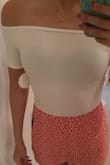 Loved how this on fit me. I don't have a large chest and the off the shoulder tops sometimes slip up or down on me and this one stayed exactly in place. I would've kept it but the fabric is too thin and you can see right through to my bra. Mind you, I am wearing a black bra so tan might work better, I still don't like the thin-ness of the fabric. - Sonja S.