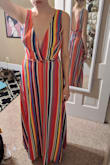 I love this dress! This was my first Lulus order, and I was so impressed with the quality! I am also glad I sized down, as suggested by other reviews. The dress was fully lined and made of a really nice slinky material that doesn't easily wrinkle. As a small-chested lady, I am a fan of the 70s deep cut like this dress has, but many dresses like that make you constantly worried something falling out. I would feel perfectly comfortable walking around in this dress without tape (but will be taping when I wear this to a wedding so I can dance with abandon). - Paige B.