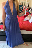 This dress is great on top, but the skirt leaves much to be desired. I love a nice wrap dress, but this one is too straight on the bottom and overlaps so much that the slit pictured is almost impossible to achieve without pulling the dress open. - Lara S.