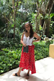 Beautiful wrap skirt that can either be casual or you can dress it up with heels! Beautiful red color. Love the ruffled edge! - Katie B.