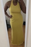 I needed a yellow dress for a friends wedding. Was really nervous that this dress would look terrible and I would end up returning. As a bigger gal it can be scary shopping online. But I whipped out the measuring tape and picked the XL. The dress is true to size. A fabric has a good weight to it but is also breathable and light with just the right amount of stretch. I have a larger bust  and the dress is lightly supportive, wouldn't do jumping jack in it if you get my drift. All in all, I'm very happy with the dress and think it's a nice balance of clean, simple, and sexy. Shorter ladies will need to get it hemmed. - Ria M.