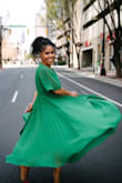 The pleats on this dress are so classic, but the bold green color makes it so fun for Spring. - Majesty A.