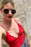 Love this red suit! Your mid section is covered, but you still feel sexy. The scalloped details add a fun twist and the back tie makes it stand out. I received so many compliments on this suit! Love it. - Erica R.