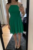 The high front and flowy material balance out being backless to make this dress both classy and cute. I'm trying to figure out the best way to wear it- a good sticky bra will probably work or even just braless. The length is great, and I love the color. - Laura B.
