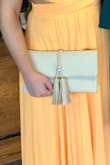This clutch is so cute and versatile! I bought it for a formal event and wore it as a clutch, but also wore it the night before for a night out with the chain - so it can totally be dressed up or down! It looks great in person and definitely more than the $25 price point. Would recommend! - Holly R.