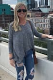 The style is so cute and I love backless stuff! It's a cute sweater just kind of thin material. Nice for a 50-60 degree day. Tons of compliments. - Michelle C.