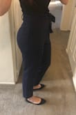 These fit perfectly! I have an athletic build and have a hard time finding pants that fit in the waist and also my butt/thighs. Pants sit comfortably right above the belly button and ankle hits above ankle on me. Perfect with a pair of ankle-strap flats! - Ariel B.