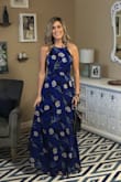 This dress is flowy and beautiful. XS fits perfect and the only reason I gave it 4 stars is because it's a pain to get in and out of due to tie back. I had to get it hemmed as it was very long on me. 2nd pic from photo shoot with Rebecca Fitzgerald. - Susan L.