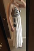 I love this dress, and I'm a little sad to be returning it, but it just didn't fit me quite right. The main issue was that it was way too short. I'm tall, 5'9", and this dress stopped right above my ankles. The top of the dress also didn't fit my chest correctly, no matter how loose or tight I re-tied the straps. If you are petite I think this dress would be perfect! - Kyrie C.