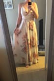 I love this dress! I got it altered to be a couple inches shorter since it was long on me, and I wanted the option to wear sandals instead of heels! Also, the button that clips the top together is not very sturdy, and so I have used a safety pin to keep it together. It is a beautiful dress. - Holly K.