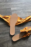 These sandals are cute to look at. The bow is a little large and I almost tripped on it. The bow comes completely untied so you have to careful to tighten it well so you don't trip. Comfort wise, these are not the shoes to wear if your planning to be in your feet all day. They made my feet sore after about 1 1/2 hrs. They are cute, but not the best for comfort. - Joy T.