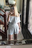The fit was true to size for me. I am always hesitant with rompers because they seem to run a little short in the back but this one fit perfect. - Tori N.