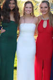 I absolutely love this dress. I wore it for prom and got so many compliments. The dress is very unique and different. The material is great quality. The pearls look beautiful on the top!!!! The fit is very flattering. I hope I have the opportunity to wear it again! - Brooke Q.