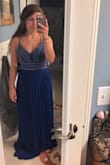 This dress is beautiful! I felt like a princess in it. I ordered a small and it fit perfectly. I have pretty a small bust but I loved the way this dress fit my chest. I ordered it in white as well and I liked that better than the royal blue just because I thought white looked better with my skin tone, but both are beautiful. - Carli K.