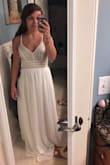 I love this dress!! I ordered it for prom and I felt like a princess when I tried it on! The beading on the top is so gorgeous and I love the way the skirt flows. I have a small bust but I think it fit my chest really flatteringly! - Carli K.