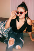 I love this bodysuit. It's really flattering, but the only thing I would say is to order a smaller size. I have a long torso, and even I had to tighten the straps all the way. However, super cute!!! Great for a night out. - Karen K.