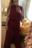 This jumpsuit is so gorgeous, and I love the way it fits on me! I ordered a larger size because there were no mediums in stock, and I was so thankful when I did cause the large fit me perfectly. So I would definitely say size up with this one but it's so pretty, and I can't to wear it to my friend's wedding! - Demi J.