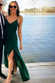 Was super flattering. Ordered a medium and it fit great in the hips and waist. Definitely drapes and is not super form fitting. Got TONS of compliments. The green color is phenom and I will be wearing this to a lot more formal events. Cannot recommend it enough. - Riley H.