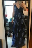 Dress was more formal than I was expecting. There is also a lot of extra fabric - if i was keeping the dress I would definitely have to get it hemmed! The back detail is beautiful, prefect dress for a formal wedding or event!! - Ceara C.