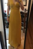 I was expecting a bright yellow from the pictures but the dress is more of a mustard yellow. The wrap quality really allowed me to tailor it to my frame, which made for a great fit. FYI to compare to other maxi wrap dresses from Lulus... this was a little shorter (about 2 inches) than the red. - Ceara C.