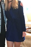 This dress was SO comfortable, yet super pretty for a night out. It can be worn so many ways with black tights, boots, heels, etc. The dress fits great and the tie is just a detail, the dress is completely secured. The v neck does have a lining which made it a little difficult to keep in place with fashion tape, but once you get it it stays. Definitely recommend. - Michelle M.
