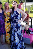 This is such a fun outfit. It has just a little midriff showing. Flowing skirt, and super comfy top. It is very long ever for me, and I'm tall. - Cait C.