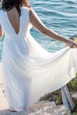 I ordered this dress for my beach engagement photos, and I absolutely loved it!! It blew in the wind and fit true to size and the pictures came out gorgeous. The only complaint I have is that the straps are a little long, so I found myself pulling them up a lot. - Mariah M.