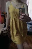 The dress is exactly as pictured. I feel like it's over priced for a sundress that doesn't have great fabric. Its rayon. You have to cold wash this or else it will shrink. I'm a size small, but I got a XS from other reviews. It's flowy and lightweight. Downside is that it's hard to put on cause there's no zippers. You get stuck on the waistline putting on and taking it off. Overall it's cute, but not worth the price! - Elain C.