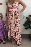 I wore this dress for my Bridal shower and received lots of compliments on it. I needed a little help zipping it up because I've always had a bigger rib cage but once it was on it fit great. Pictures don't do it justice. The color is beautiful in person and flows great. - Brandy G.