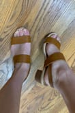 These sandals are a great closet staple. I generally get a 6.5 or 7 when it comes to sandals and heels, but after reading other reviews I went with a 6.5 and I'm happy I did! I have semi-wide feet already so was glad that these shoes weren't tight around my toes whatsoever. They feel a little loose in the back, but nothing the strap can't fix. I was a little surprised by the quality at first as the material does feel a little on the cheap side, but it's expected with such an affordable price. The heel is much lower than I anticipated as well, only about an inch or so. However, I love the tan color and the woodblock, so will def be keeping them! - Stephanie S.