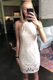 This dress fits very true to size. It is so flattering and I really love the open back. The dress is very well made. I wore it for my senior photos & will be wearing it for graduation as well! - Michelle O.