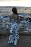I wore this on my honeymoon and I got so many compliments and felt so happy in the dress! It fit perfectly, though since I am short I did need to have it hemmed but that's pretty standard for my height and not really an issue with the dress. The material gets a little wrinkly when sitting for a long time, but the pattern hides that pretty well. I would buy this dress again in a heartbeat and will definitely wear it again! - Amy C.