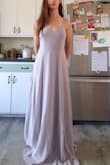 I'm on the taller side and this dress has enough length to wear 3 or 4 inch heals. I ordered a medium because of the waist so there was some gapping on the sides. I did some minor alterations on the side of top that were very easy and took about half an hour by hand. The material was easy to work with, and I love the weight. The straps are thin but very sturdy and I love the buttons. I also have a higher waist and it sits very nicely and is loose and tight in all the right places. - Naomi B.