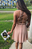 absolutely gorgeous dress!! i got so many compliments when i wore this at graduation! the detail of the back is so flattering, and really pops - while the front is more modest, a light and flowy material which really adds to the comfort aspect. the way that the back ties, makes it really adjustable no matter your chest size (i wore a small even though I'm a DD cup). I've seen some reviews mentioning it being a little see-through, however i didn't think so! i wore pasty petals and it was fine.  
additionally, i was able to re-wear this during the summer either casually (dressing it down) or for a night out/nice dinner. because of the color being so neutral, it's easy to pair with most jackets, shoes, and purses. - Maia C.