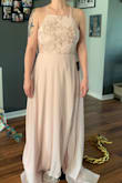 I adore this dress.  It is a very light pink. Absolutely beautiful. Fits perfectly and is great for those who don't want to show cleavage.  However it is very long. - Tess M.