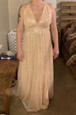 I thought I was going to fall in love with this dress but unfortunately did not. It fit too awkwardly and is more of a peach color than pink. It was huge in the bust area so I tightened the straps as far as they would go but then the top was too high and then the back was too tight. The waist band also didn't fit correctly and wasn't fitted and just hung awkwardly.  This dress really exposes your chest so if you don't want to show cleavage then I wouldn't recommend. However I loved the sparkle and sequins on this dress. The dress it's self is gorgeous just didn't fit me properly. - Tess M.