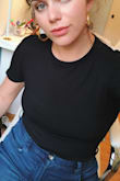 I LOVE this bodysuit. It fits well and it a little loose in the right places but not too obvious. Bought every color and pair it with jeans when I need a casual but comfy look for work. 100% recommend. - Katherine N.