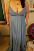 I ordered 2 other dress from Lulus for my friend's wedding and this is the one I chose to stick with. The bottom flow so beautiful. It is heavy but not something that you can't handle. Super long but I appreciate that it give people chance, short or tall people. I hem about 4 inch off. The top is tight if you're a bigger chest like me but it really curve my body and show my "assets." Definitely a must have dress in the closet for special occasions. - Yer V.